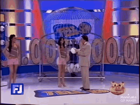 a man and two women are on a television show .