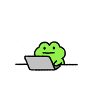 a green frog is sitting in the dirt with a stick in its mouth .