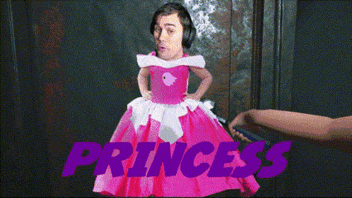 a man in a pink dress with the word princess in purple letters
