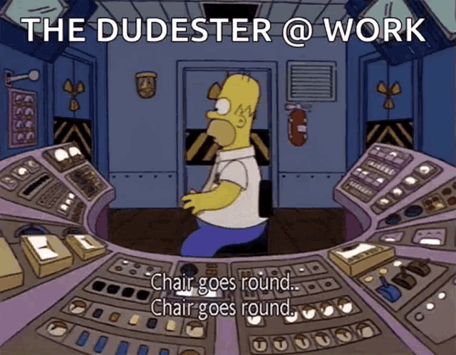 a cartoon of homer simpson in a control room with the words " the dudester @ work "