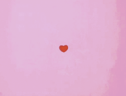 red hearts are falling from the sky on a pink background .