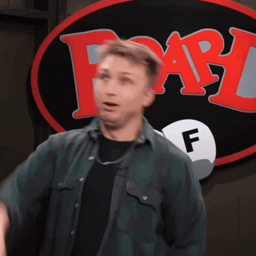 a man in front of a sign that says fab