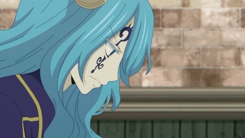 a woman with blue hair has a tattoo on her face that says s