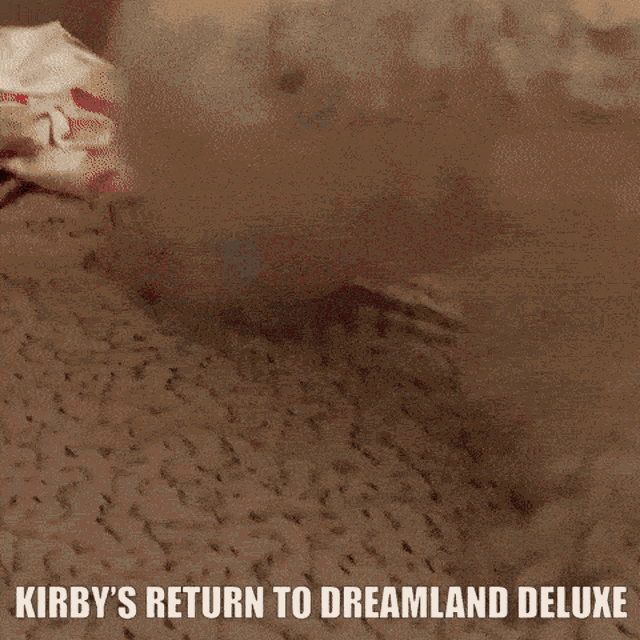 kirby 's return to dreamland deluxe is written on a poster