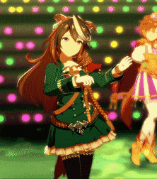a girl in a green dress is standing in front of a stage with lights behind her