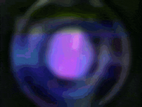 a purple and blue circle with a purple glow in the middle
