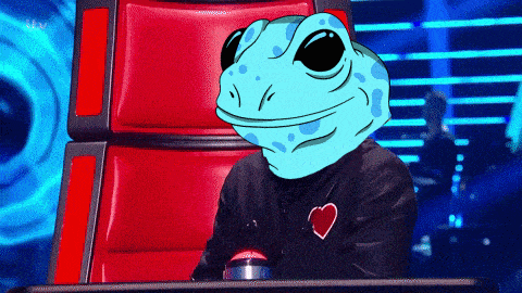 a man with a frog head is sitting in a red chair