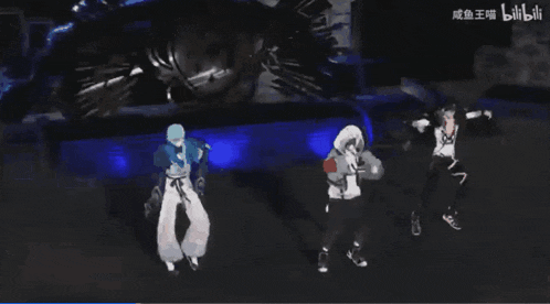 three people are dancing in front of a sign that says bilibili on it