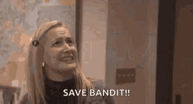 a woman is saying `` save bandit '' in front of a map of the world .