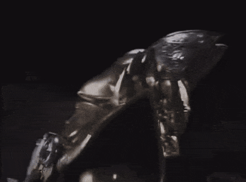 a knight with a spear is fighting another knight in armor