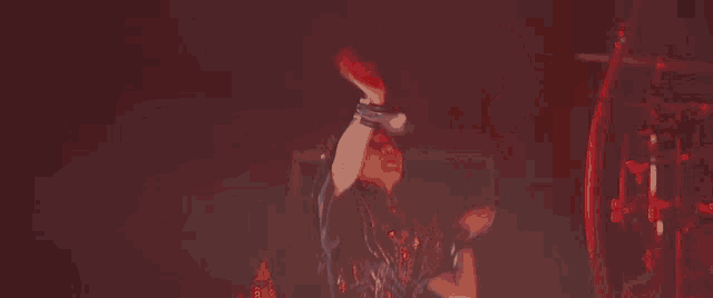a man in a black shirt is dancing in front of a microphone