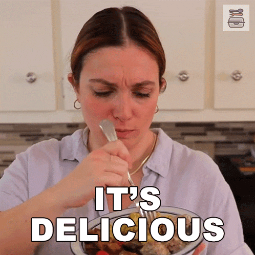 a woman eating a plate of food with the words it 's delicious on the bottom