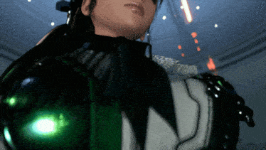 a close up of a person 's face with a glowing green item in the background