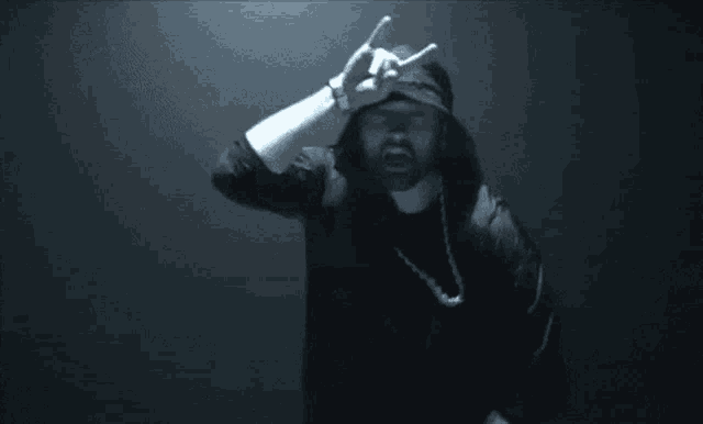 a blurry picture of a man in a hooded jacket