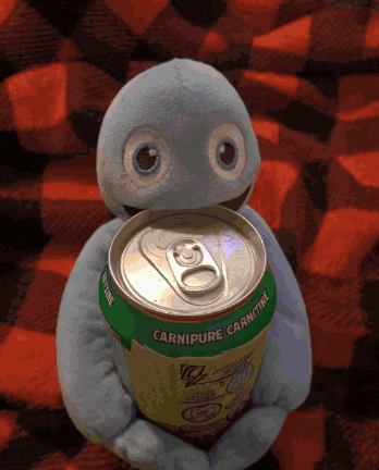 a stuffed animal holding a can of carnipure