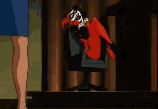 harley quinn is laying on her back in a chair while a woman stands behind her .