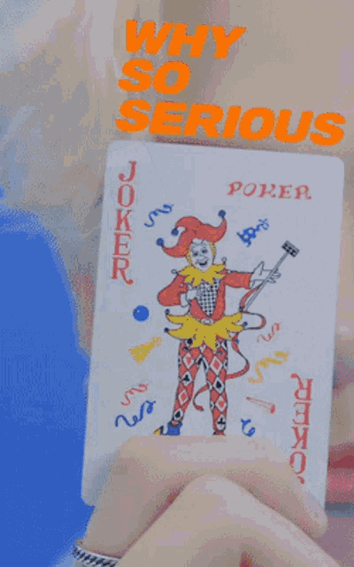 a person is holding a joker playing card with the words why so serious above it