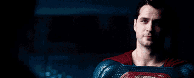 a close up of a man in a superman suit