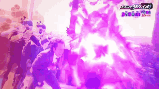 a group of people are standing in front of a purple background with the word kamen rider written on it .