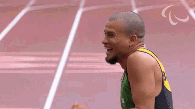 a man on a track with the letter c on the bottom right