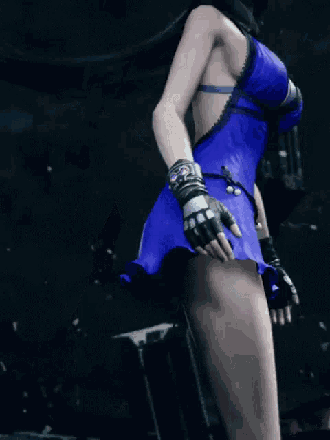 a woman in a blue dress and black gloves