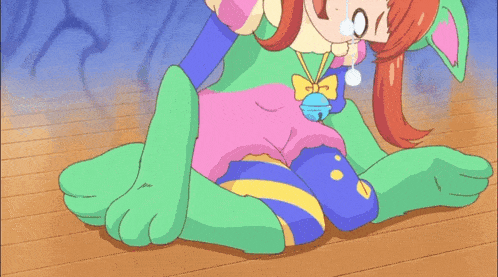 a girl in a cat costume is laying on the floor and says lacking