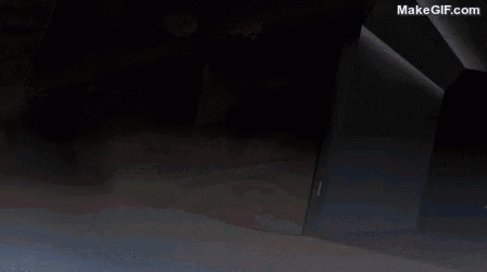 a person is walking barefoot on a white surface in the dark .