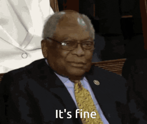 a man in a suit and tie with the words it 's fine on his face