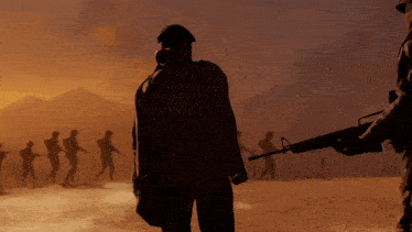 a man wearing a gas mask stands in front of a group of people