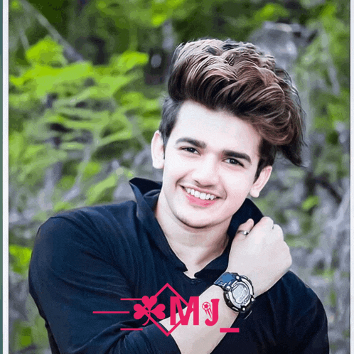 a young man wearing a black shirt and a watch with the letters xmj on the bottom