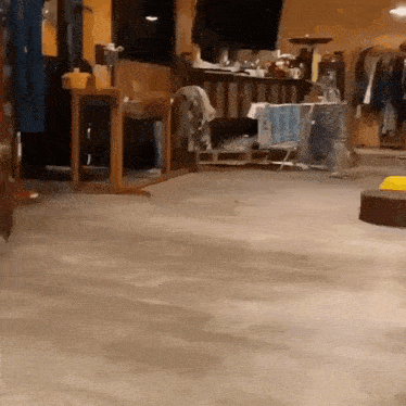 a room with a concrete floor and a few pieces of furniture
