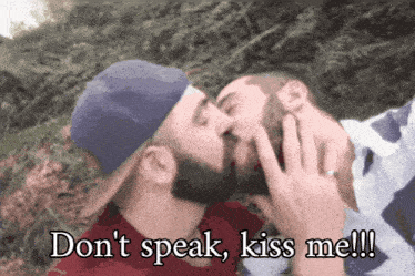two men kissing with the words " do n't speak kiss me " written below them