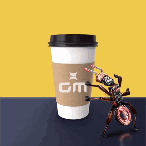 a robot standing next to a cup that says gm on it