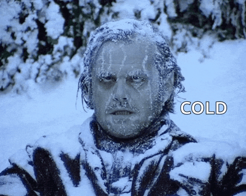 a man is covered in snow and the word cold is on the bottom