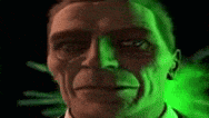 a close up of a man 's face with a green background