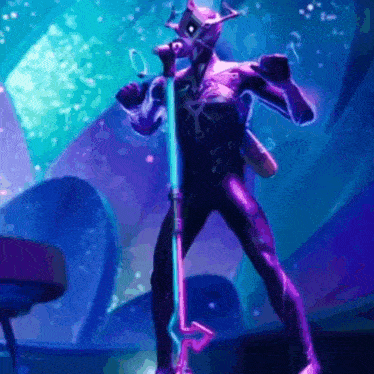 a man in a purple suit is singing into a microphone .