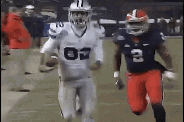 a football player in a white jersey with the number 11 on it