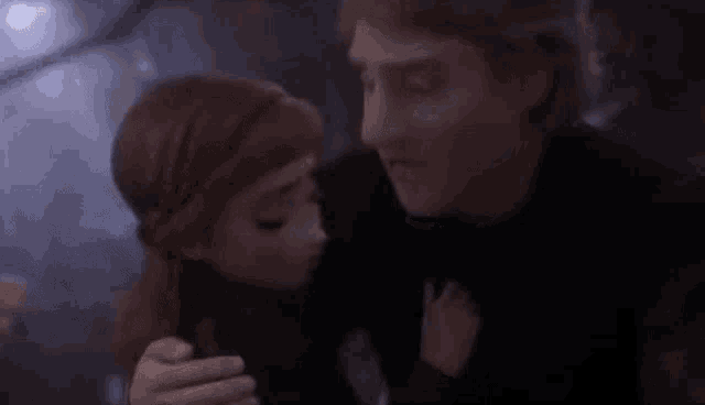 a man and a little girl are looking at each other .