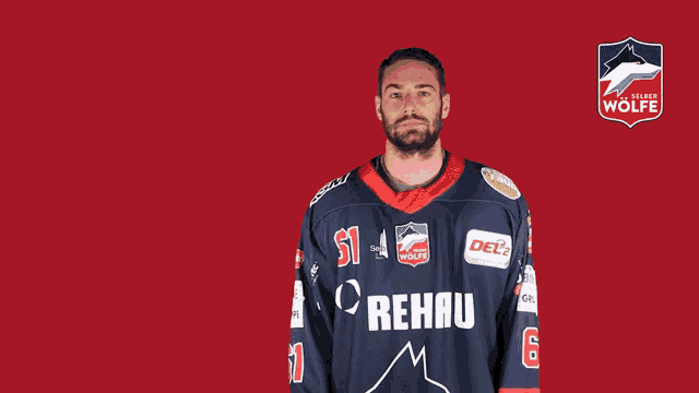 a man wearing a jersey that says rehau