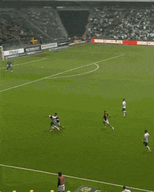 a soccer game is being played in a stadium with a sign that says arena