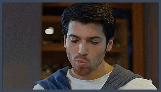 a man with a beard making a funny face with his mouth open