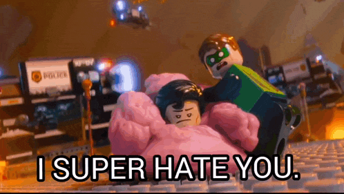 a lego man is holding a lego woman in a bed and says i super hate you .