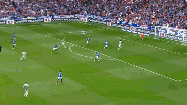 a soccer player covering his face with his hands in front of a dafabet ad