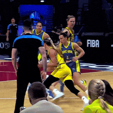 a female basketball player wearing a blue jersey with the number 3 on it