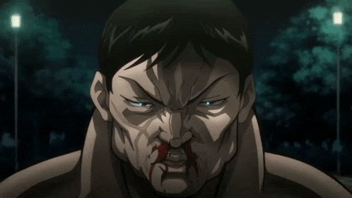 a close up of a man with blood on his face