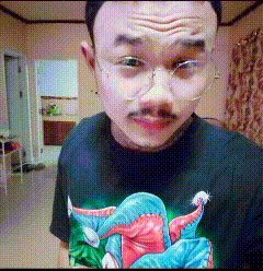 a man wearing glasses and a black shirt with a picture of an elephant on it