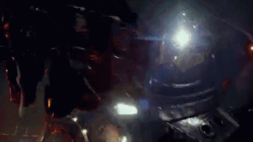 a close up of a light shining on a dark surface