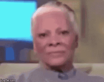 a close up of a man 's face with a blurred background .