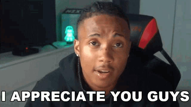 a man is sitting in a chair with the words i appreciate you guys on the bottom
