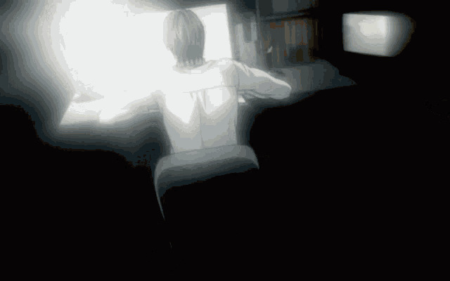 a black and white drawing of a person sitting in front of a computer